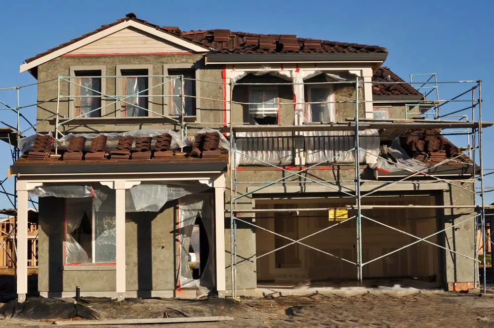 A new home in the process of being stuccoed