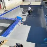 Men Smoothing Plaster With A Trowl